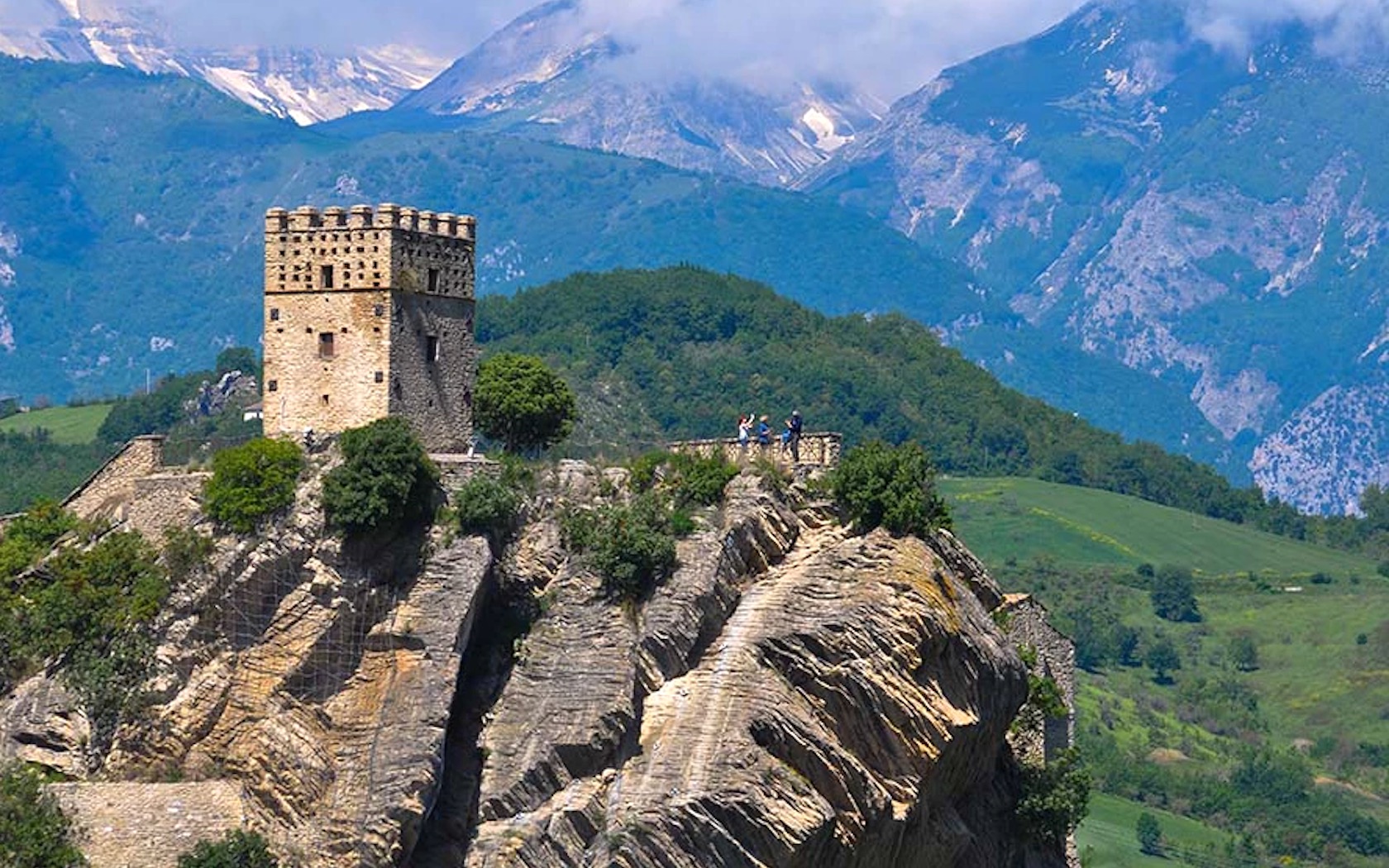 The castle hotel Castello Roccascalegna in Italy, perched on a craggy hill.