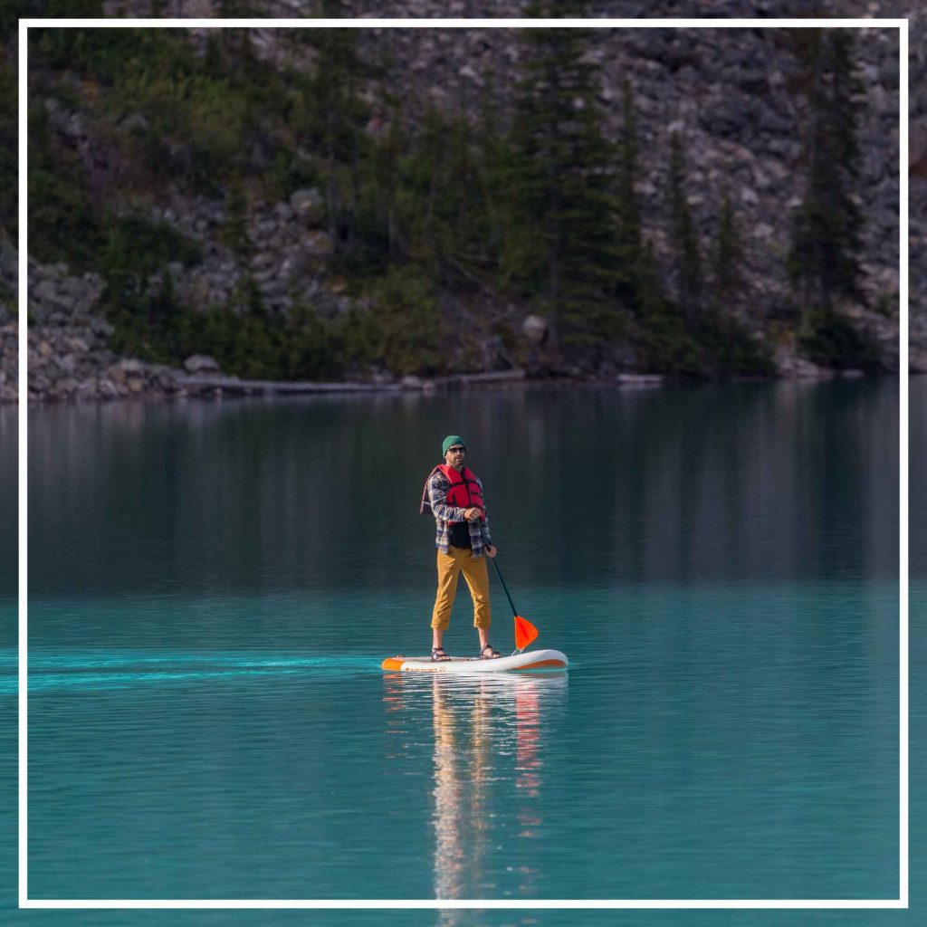 Just a guy stand up paddle boarding on Moraine Lake at 7am in the morning. Best time to do it, very quiet ;)