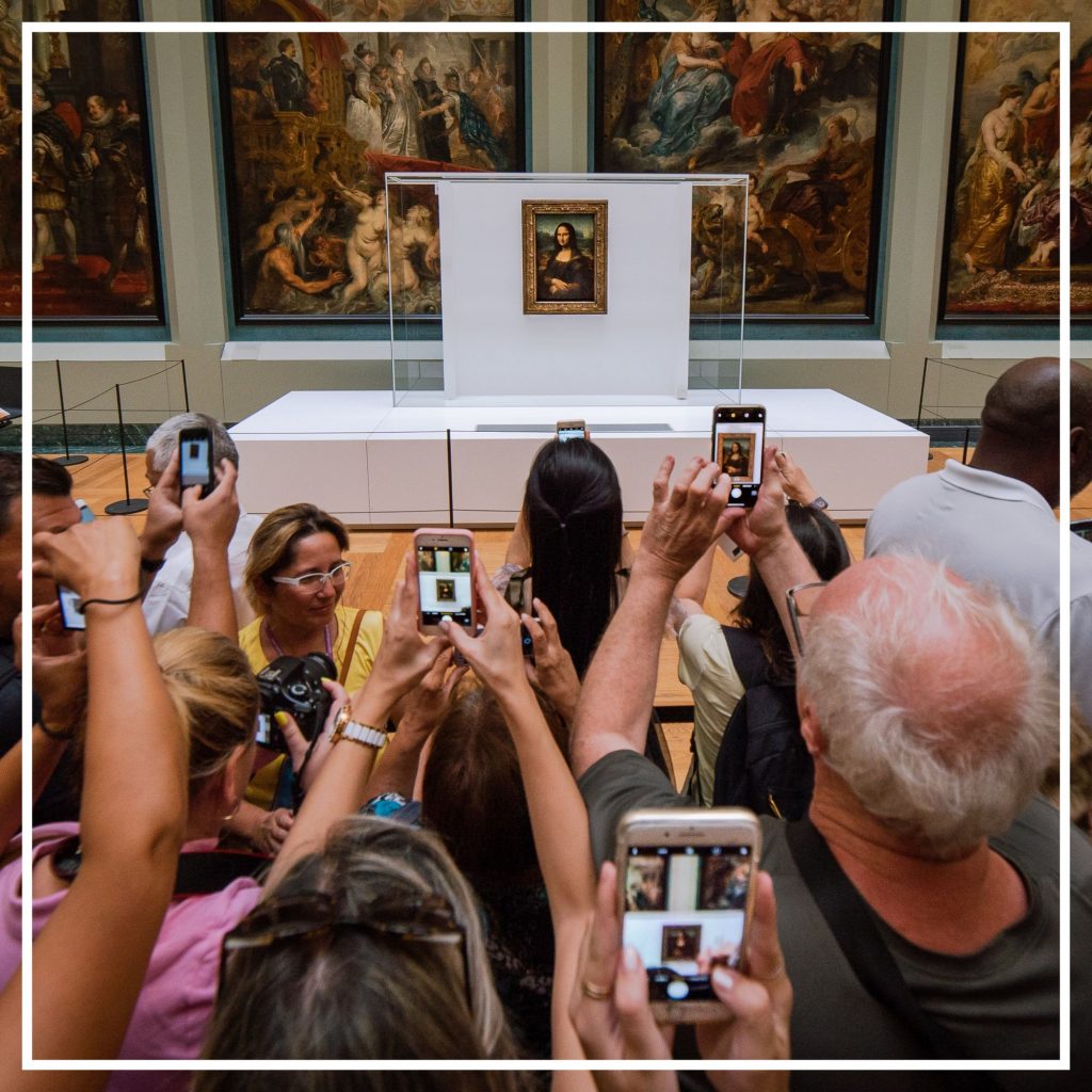 People crowding around the Mona Lisa